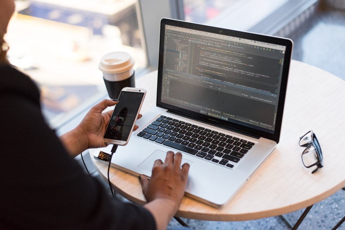 Remote working on laptop and phone