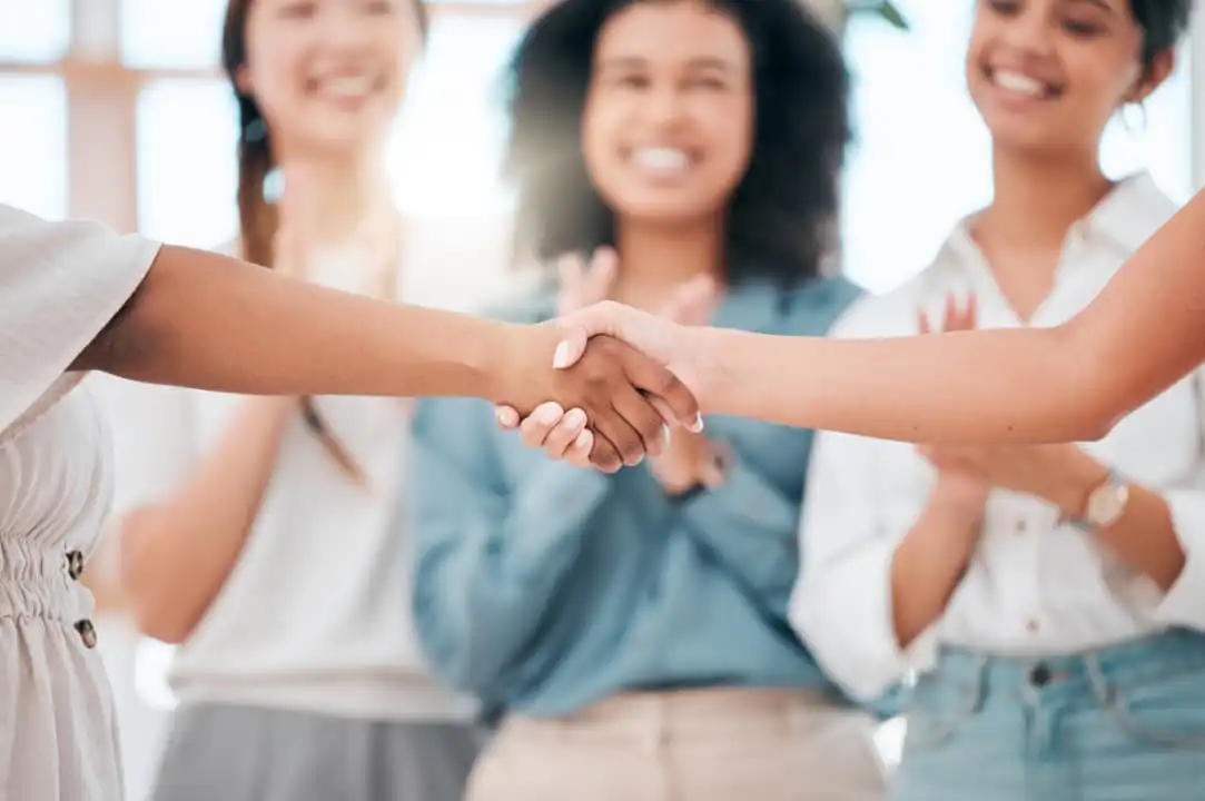 A group of people happily welcoming their new member in the group A group of people happily welcoming their new member in the group