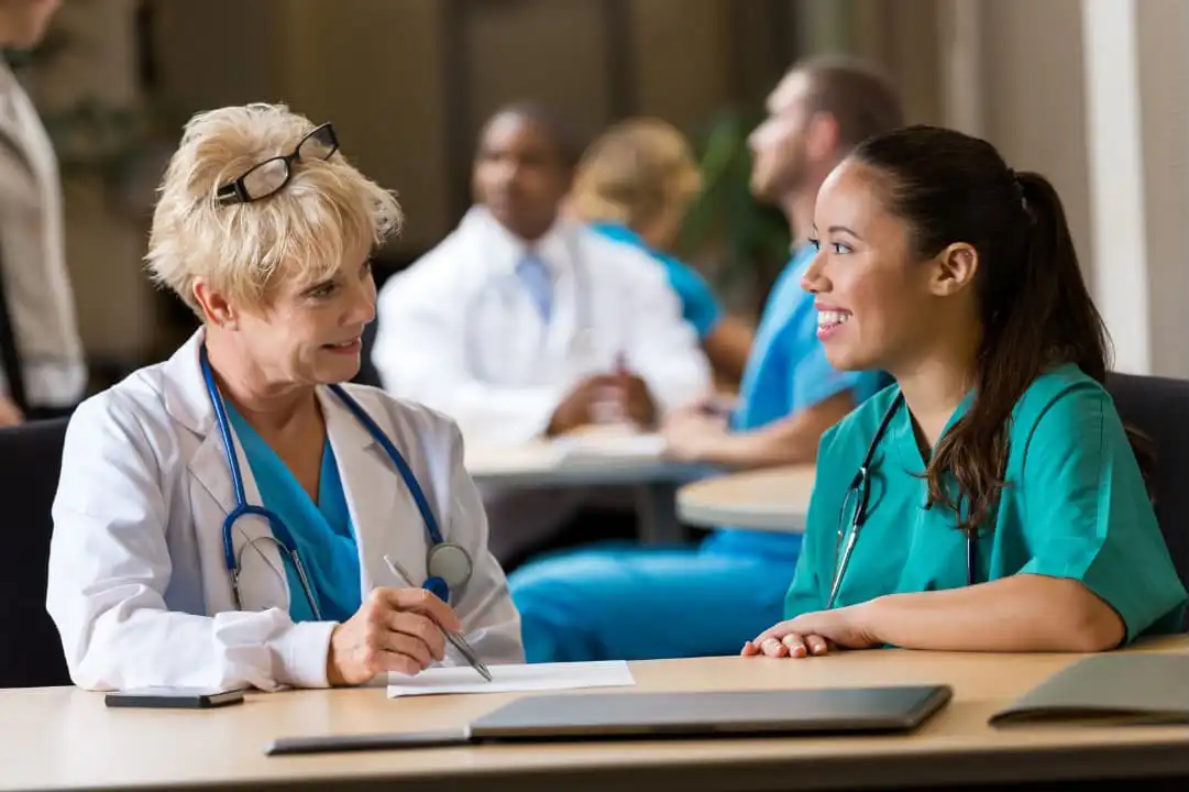Nurse conducting interview of an applicant in the healthcare industry