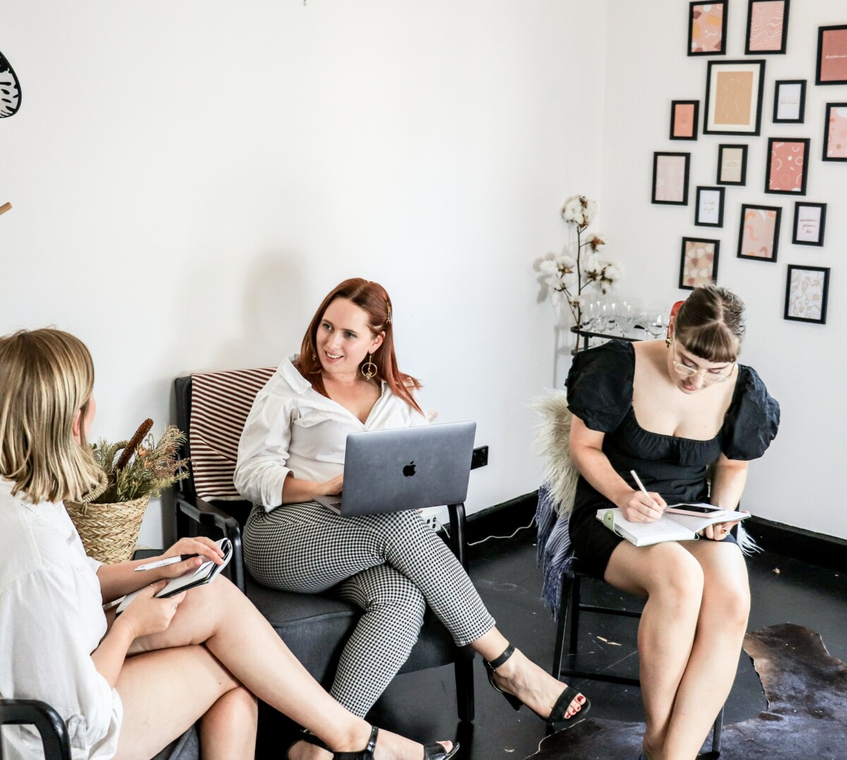 3 female managers sitting and working together