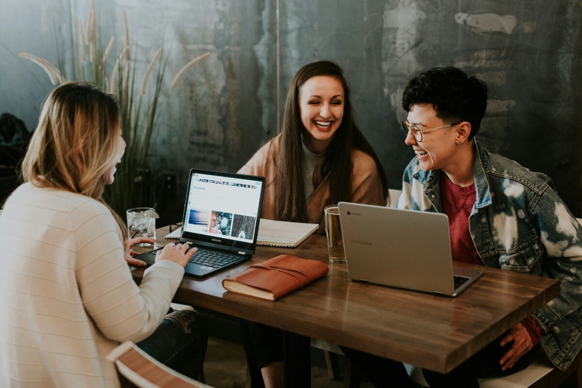 3 people having a good time in the office