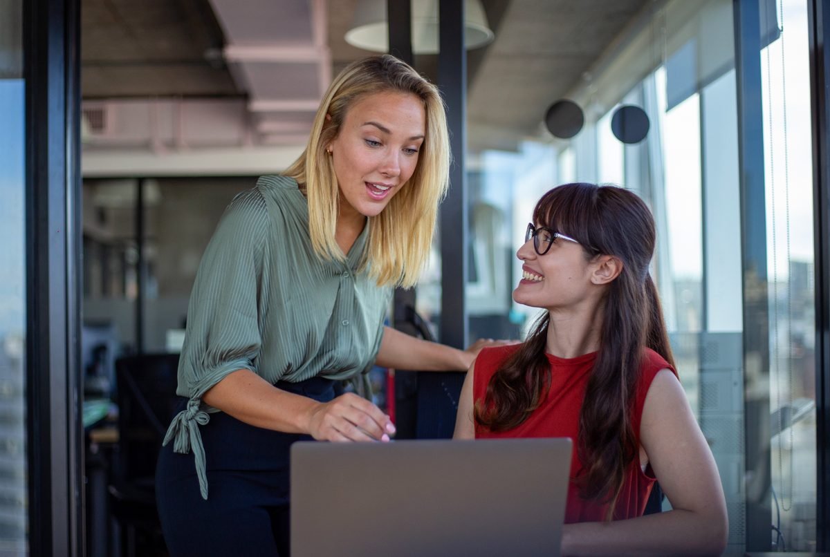 Two HR professionals working together on a laptop, Europe HR Solutions partner program